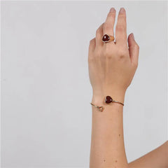 ANEL CORAÇÃO DOURADO PEDRA CABOCHÃO LISO