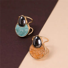 ANEL DE REGULAGEM DOURADO EM HEMATITA COM PEDRA FRAGMENTADA