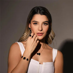 ANEL DE REGULAGEM DOURADO EM HEMATITA OVAL DUAS PEDRAS