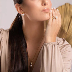 BRINCO TORCIDO PÉROLAS DOURADO