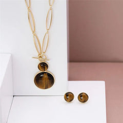 CONJUNTO DOURADO DUAS PEDRAS CABOCHÃO FECHO FRONTAL