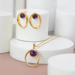 CONJUNTO EM AMETISTA COM DESIGN ELEGANTE DOURADO