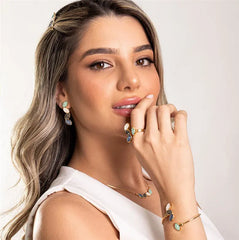 CONJUNTO DOURADO COM QUATRO PEDRAS FRAGMENTADAS