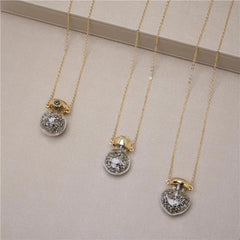 PINGENTE GARRAFINHA ZEN DOURADO COM PEDRINHAS (lisa)