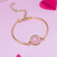 PULSEIRA AJUSTÁVEL PEDRA REDONDA NATURAL CABOCHÃO DOURADO