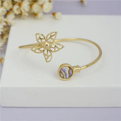 PULSEIRA DOURADA FLOR COLEÇÃO GARDEN PEDRAS DO MAR