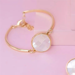 PULSEIRA PEDRA REDONDA EM MADREPÉROLA DOURADO