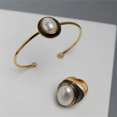 PULSEIRA PÉROLAS DOURADO COM RODIO NEGRO OVAL