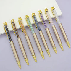 CANETA DOURADA COM TINTA PRETA E PEDRA NATURAL